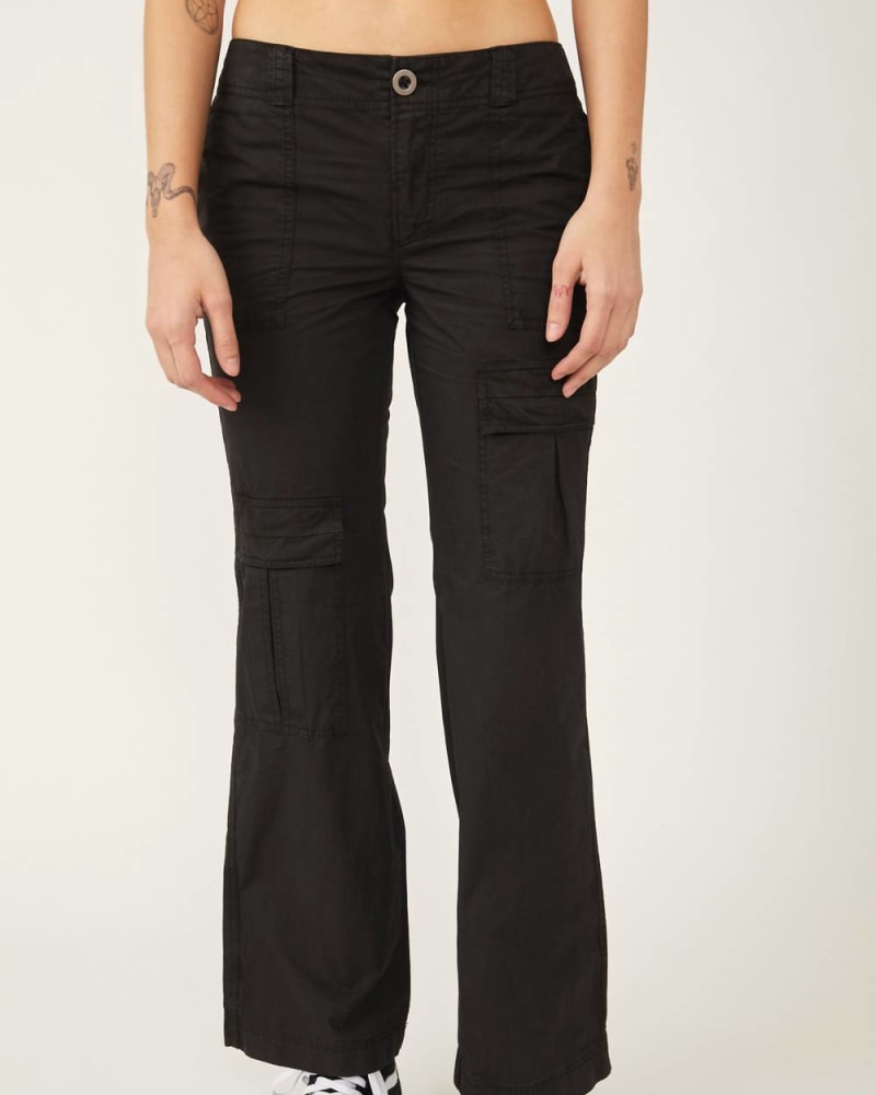 Front of a model wearing a size 10 The Thing Is Low Rise Utility Pant In Black in Black by Free People. | dia_product_style_image_id:355803